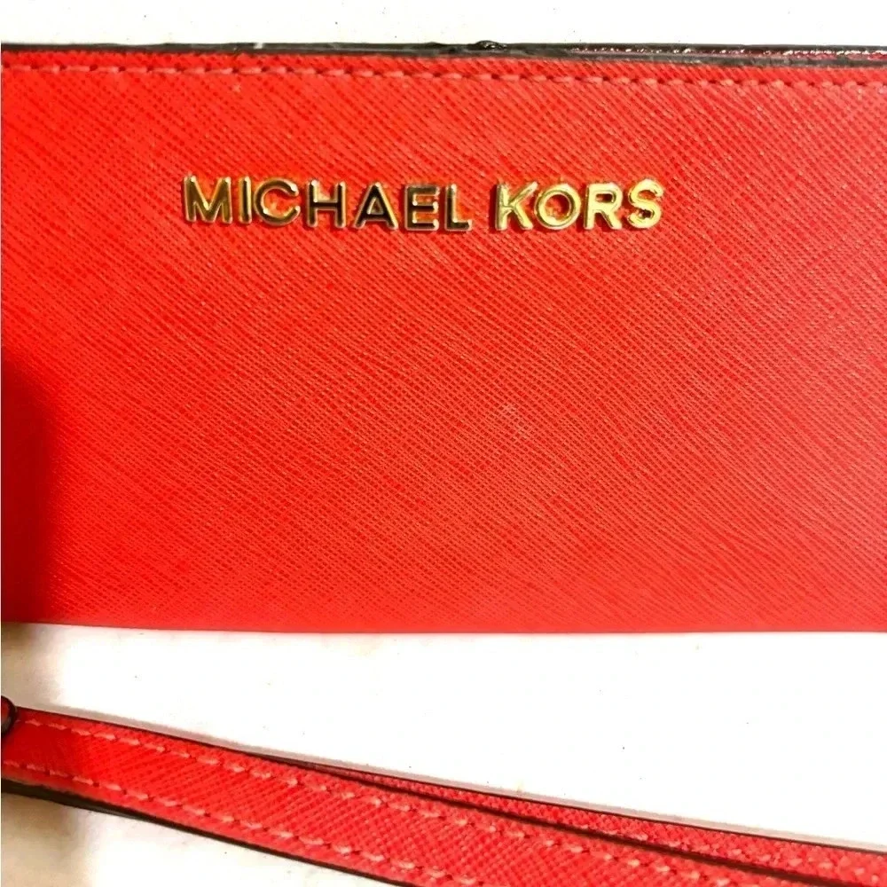 Michael Kors orange leather leather wristlet wallet